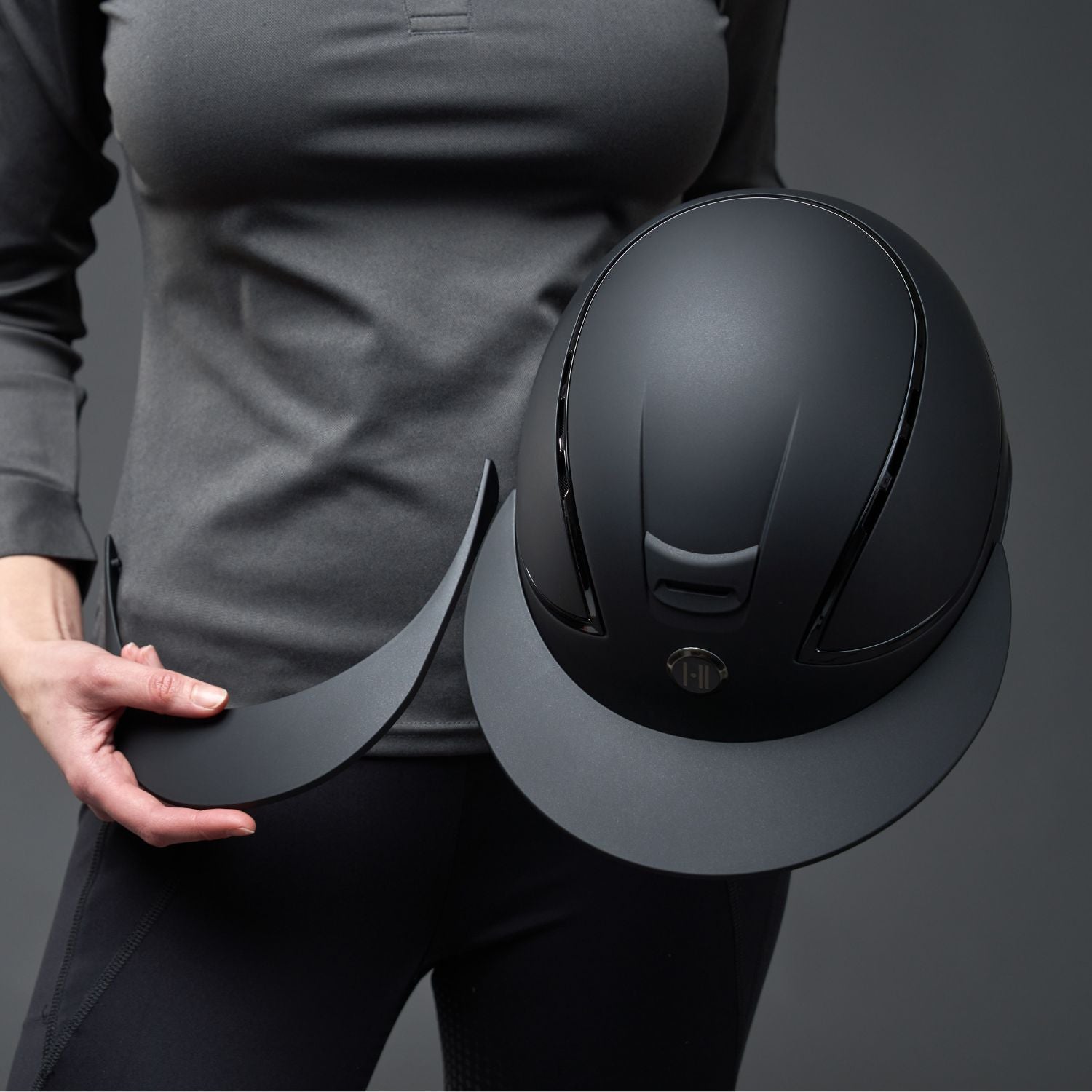 Riding helmet with replaceable brims