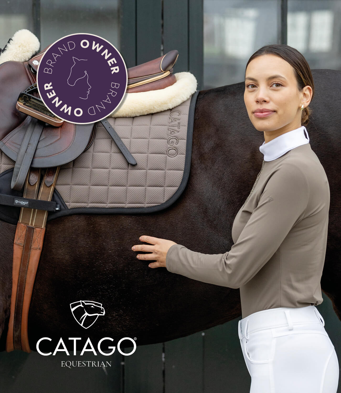 Woman standing next to a horse with a Catago equestrian saddle and pad, brand owner badge visible.