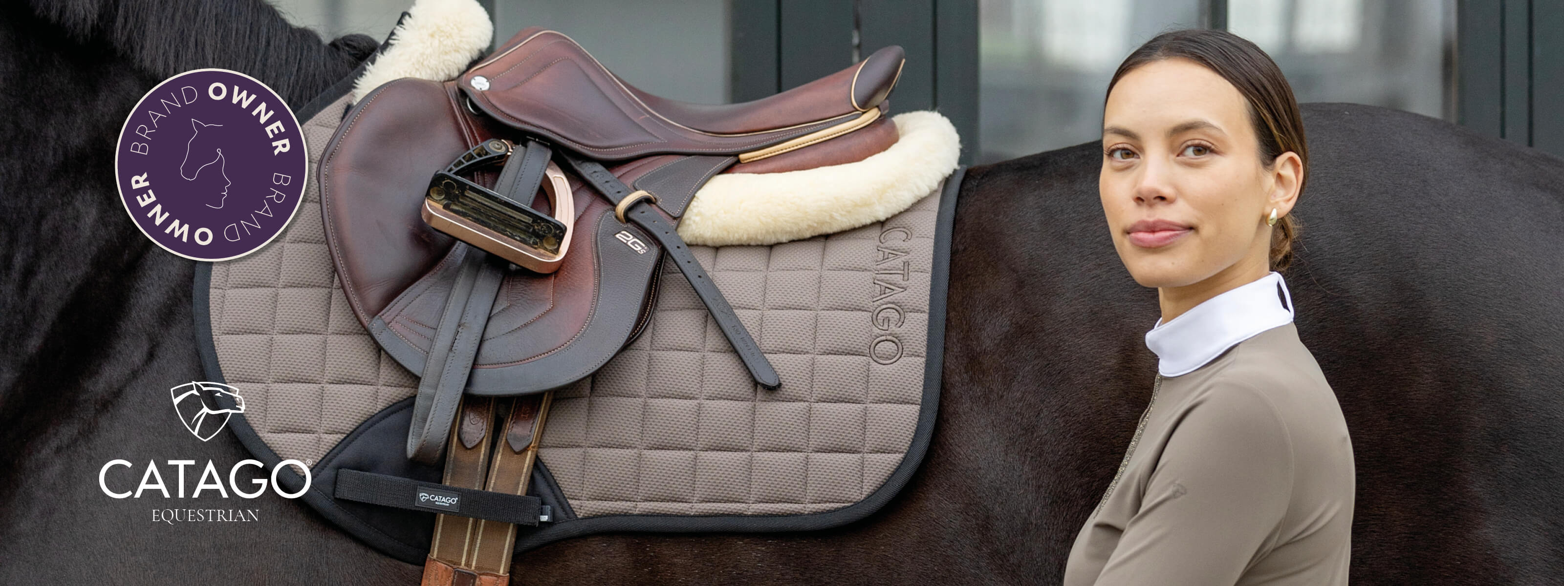 Woman standing next to a horse with a Catago equestrian saddle on a blurred background