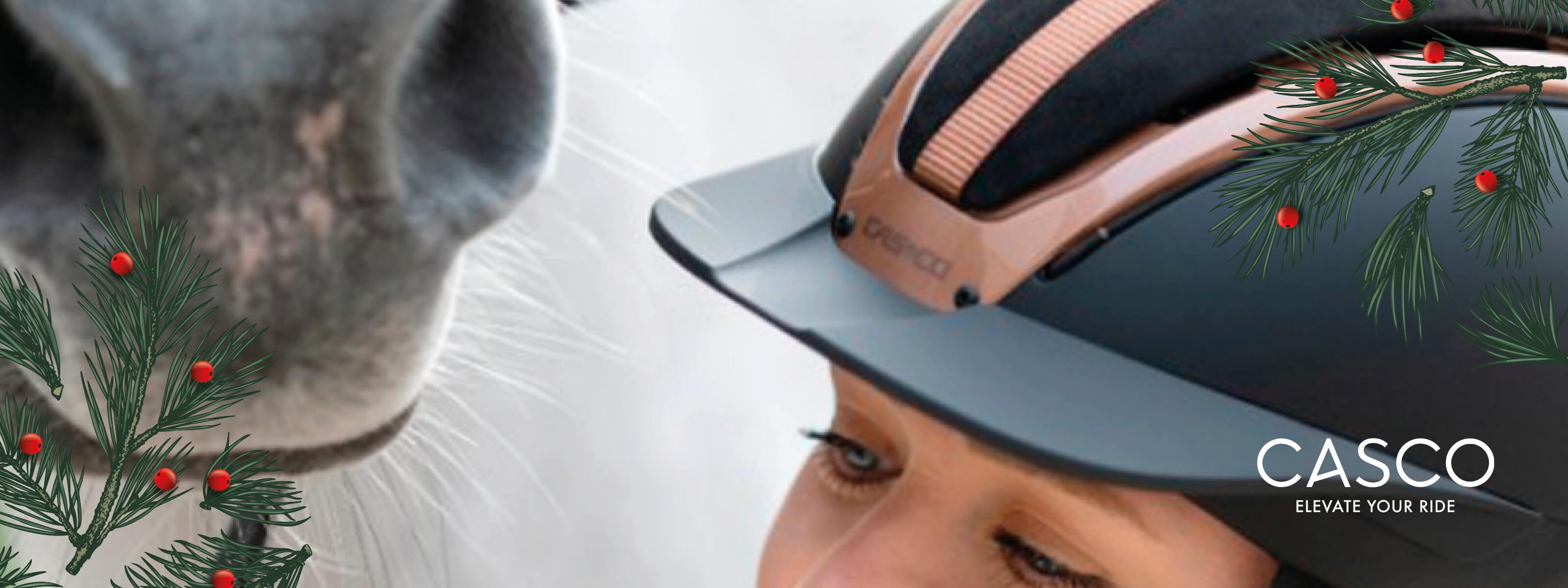 Person wearing a Casco helmet with a horse in the background