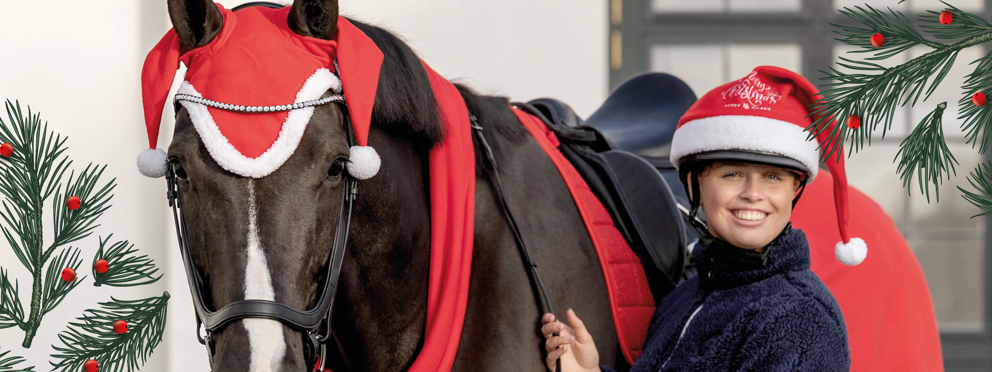Horse and rider wearing Christmas hats with festive decorations in the background